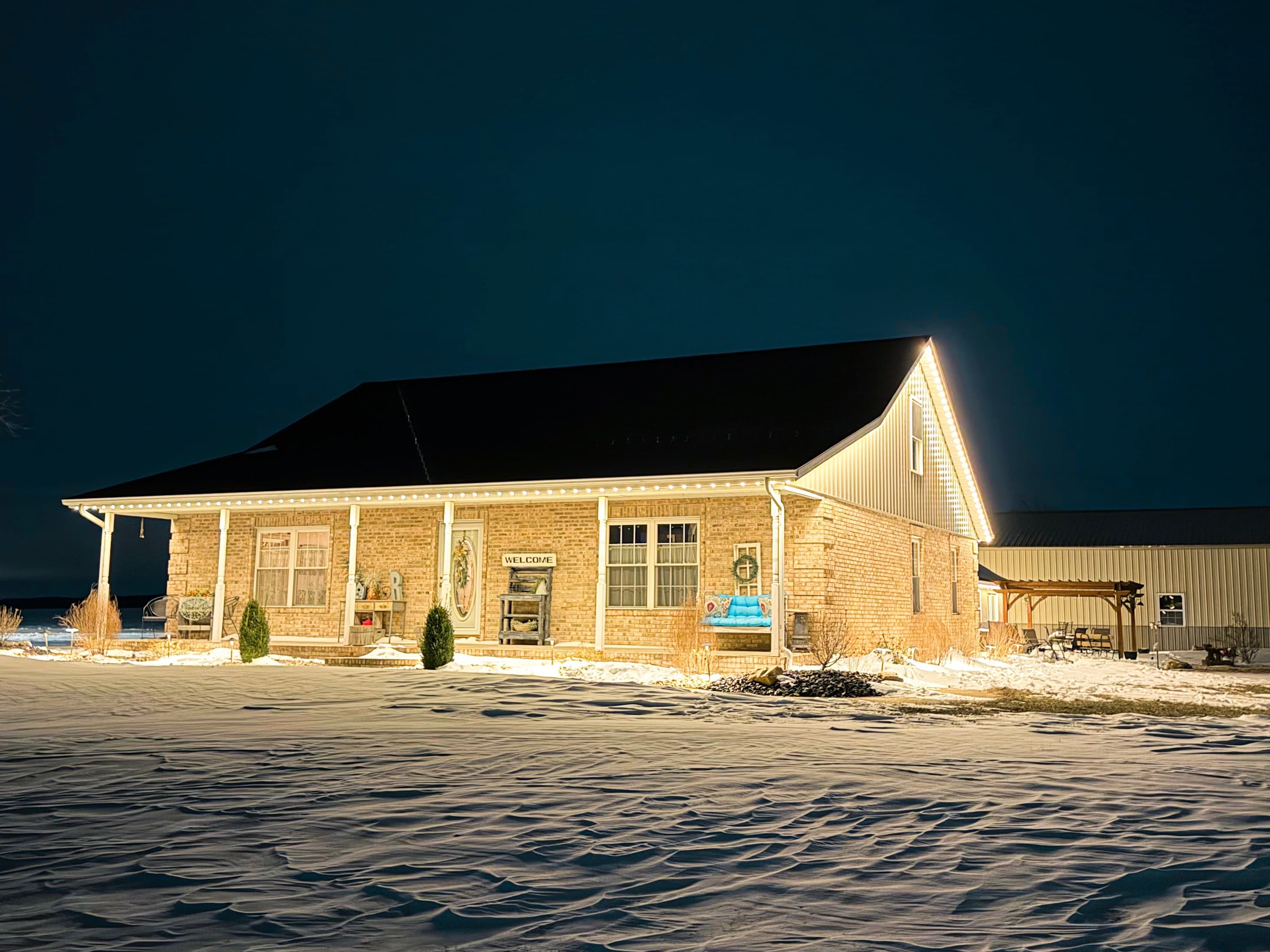 TruLight manufacturer example: Home with full permanent LED lighting display at night