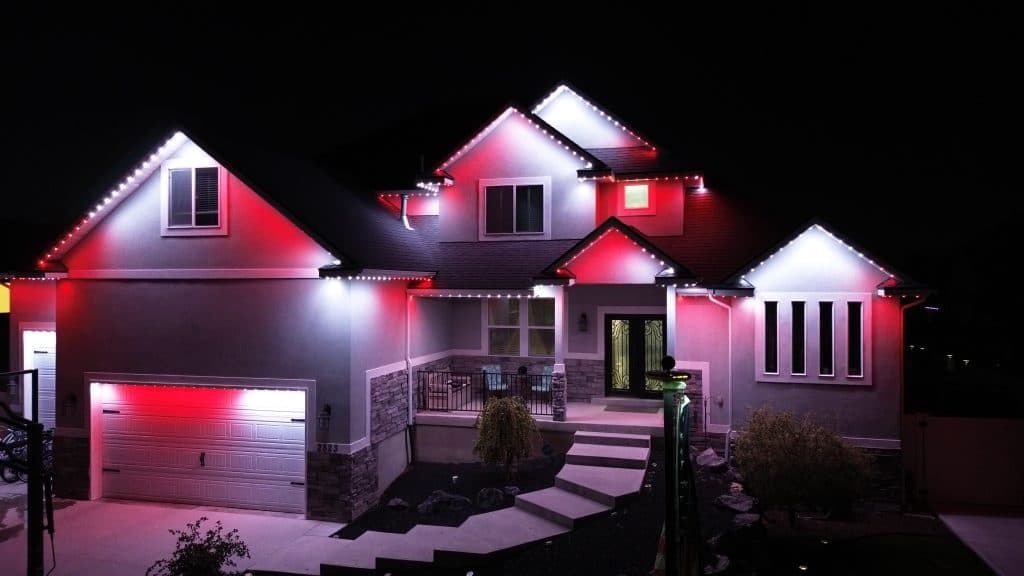 TruLight manufacturer example: Aerial view of home with permanent LED roofline lighting