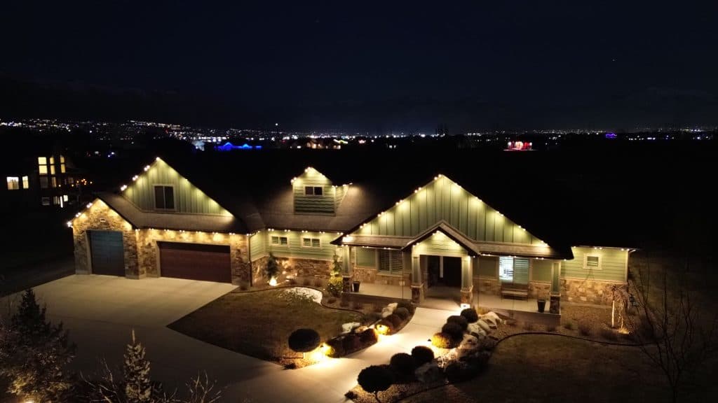 TruLight manufacturer example: Drone shot of permanent LED lighting on home roofline